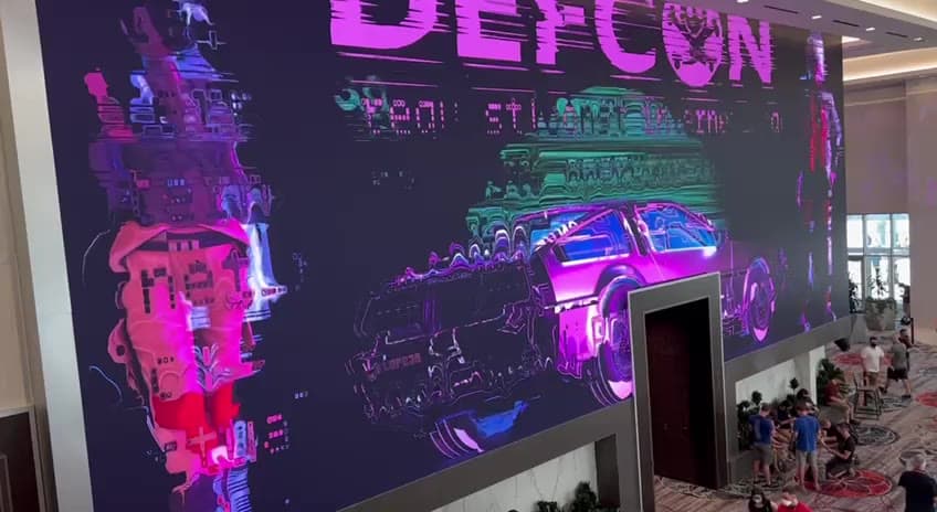 A large animated board introducing DEF CON