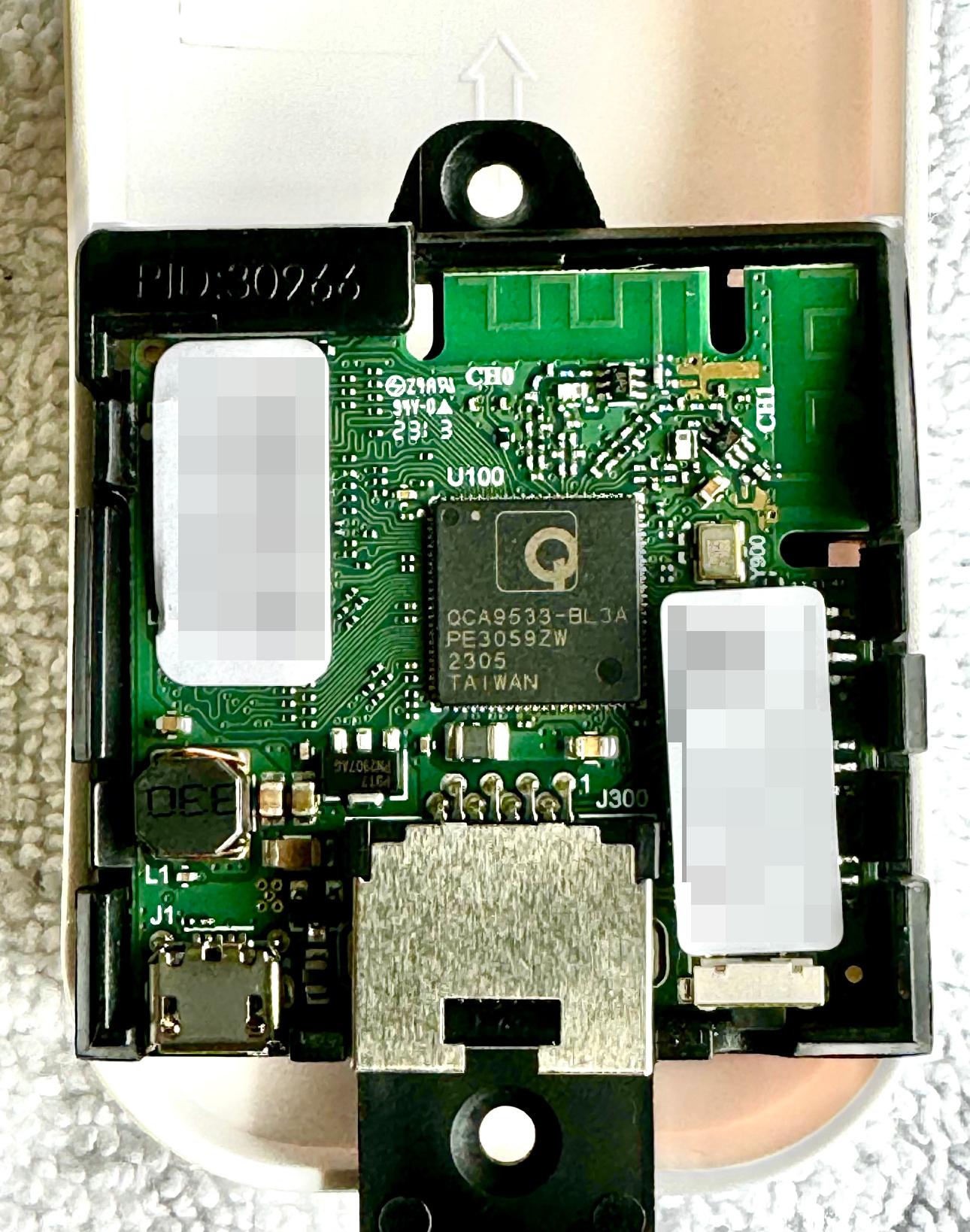 A small square circuit board with a metal ethernet port