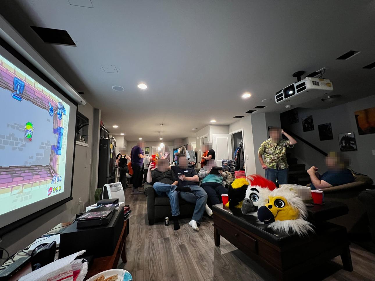 A picture of a party on new years with several people enjoying themselves.